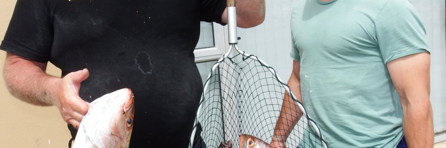 Vlnr is Ben Uys en Jacques Swanepoel met hulle goeie vangstes vanaf Ben se boot, Oupa